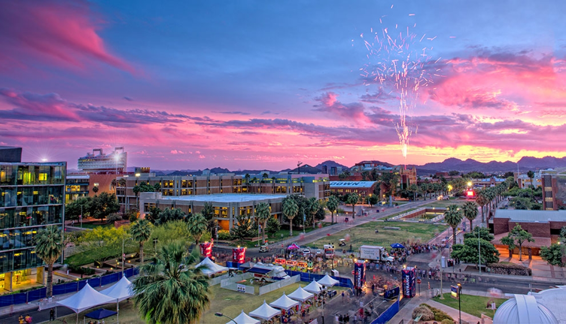 Fireworks over the campus at sunset